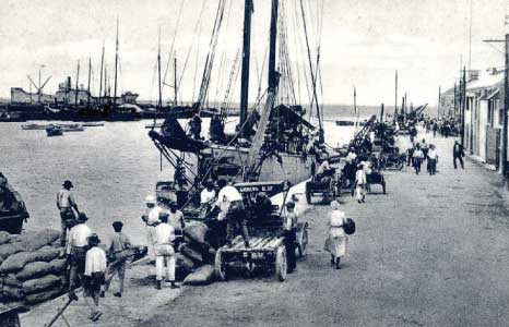 Goods Being Offloaded at the Careenage in Years Gone By, Barbados Pocket Guide